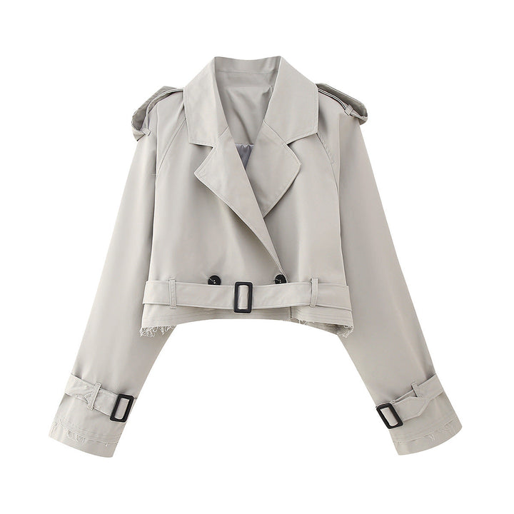 Stylish women's cropped trench coat with adjustable belt, a key piece for any wardrobe.