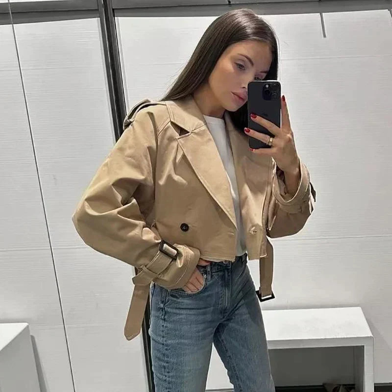 Ladies' fashion short trench coat with belt, perfect for a sophisticated and modern look.