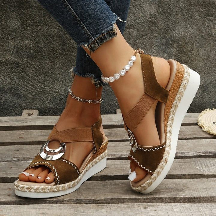 Women's casual snake print wedge sandals with a stylish wedge heel. Comfortable & trendy summer style.