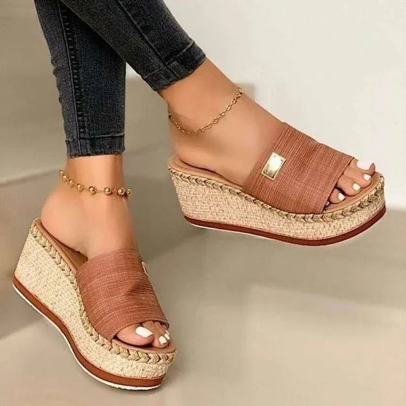 Sleek open-toe slip-on wedge platform sandals for women, a stylish choice for summer footwear.