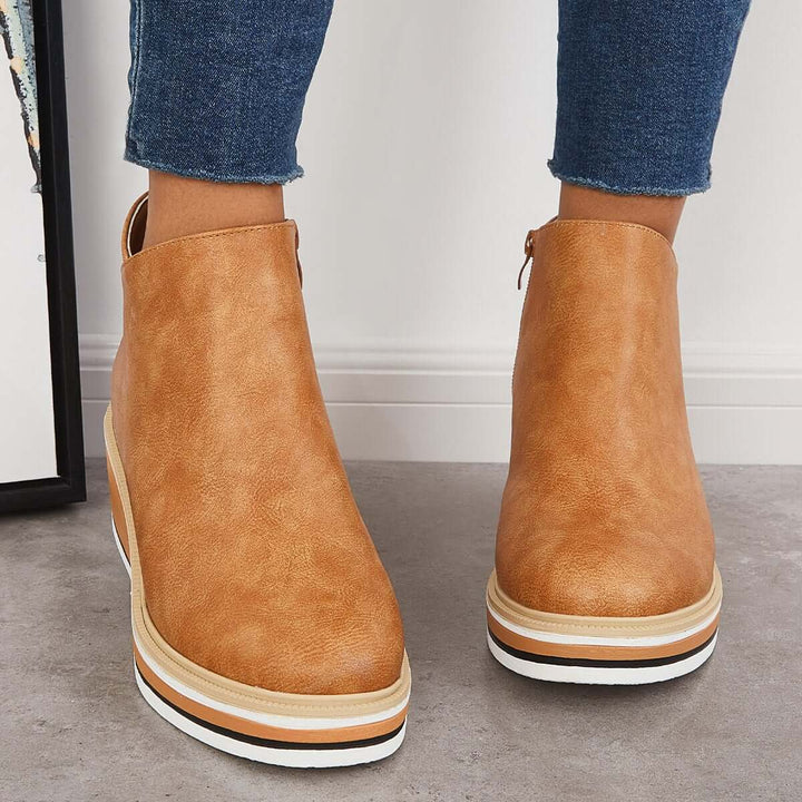 Trendy women's black ankle boots, featuring a bold zipper & comfortable platform sole.