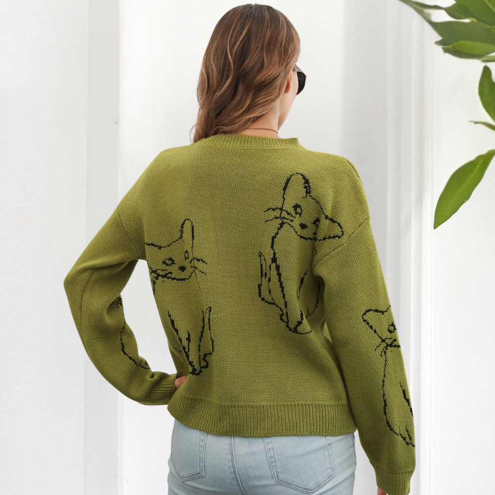 Cozy women's animal print sweater, fashionable cat design, perfect for fall and winter outfits.