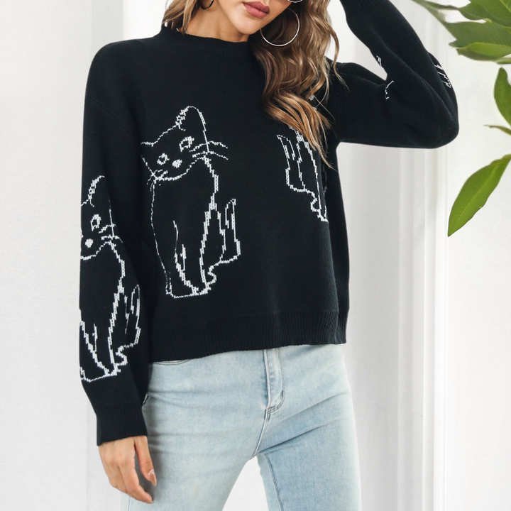 Trendy women's pullover sweater featuring a charming cat print, ideal for casual fashion.