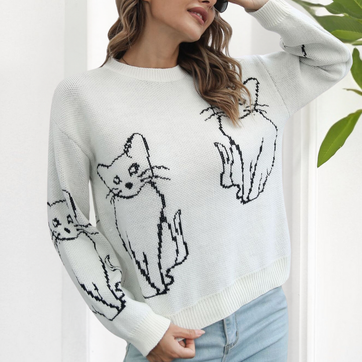 Soft women's cat print sweater, a warm and trendy top, great for fall and winter comfort.