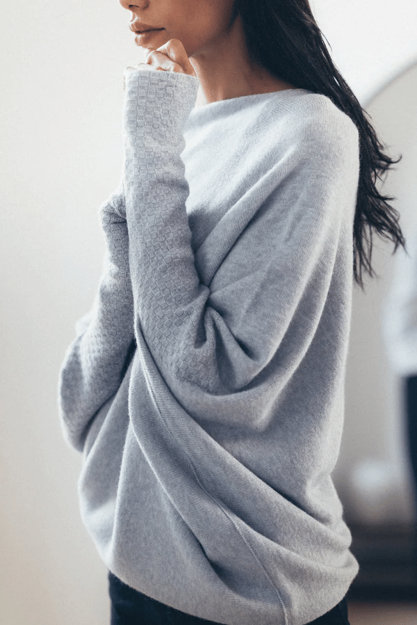 Comfortable women's off-shoulder knit sweater, soft and elegant for daily wear.