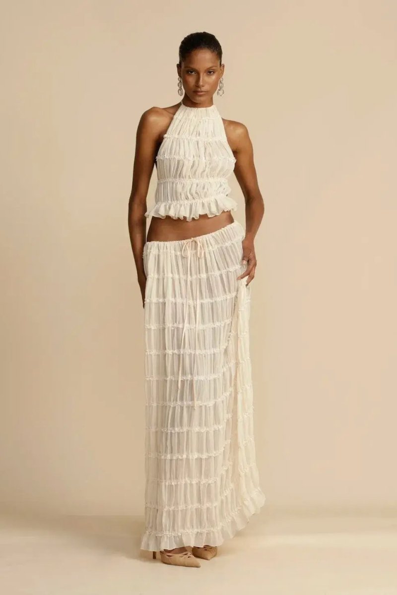 Casual elegant women's summer two-piece set: a stylish halter top and a comfortable maxi skirt for vacations.