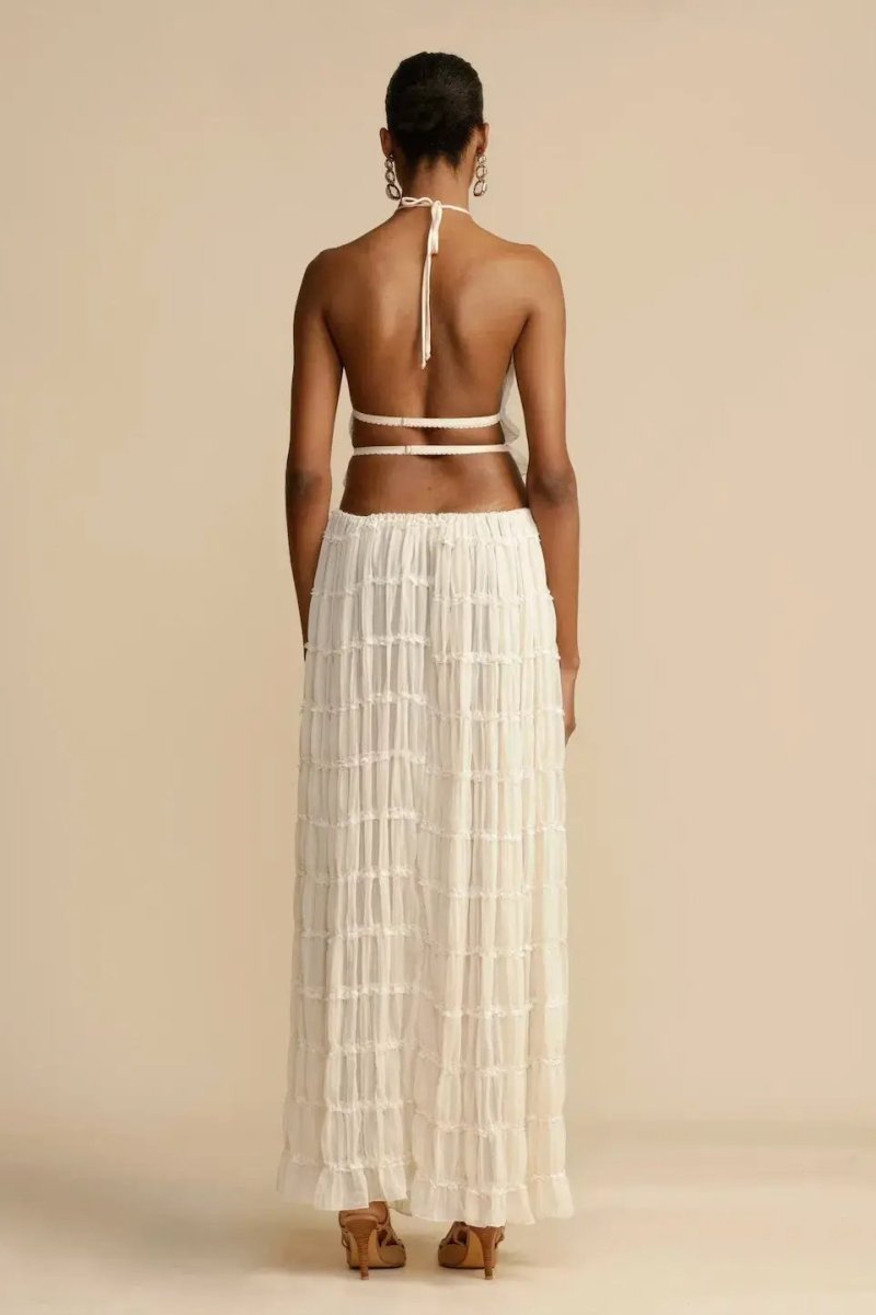 Chic women's summer two-piece set: a trendy halter top paired with a long, elegant flowy maxi skirt.