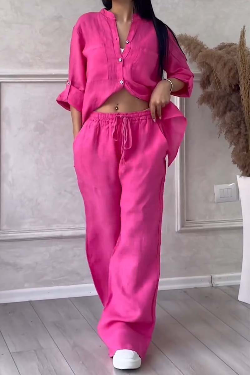 Stylish women's two-piece set; elegant blouse paired with wide trousers, a versatile casual outfit.