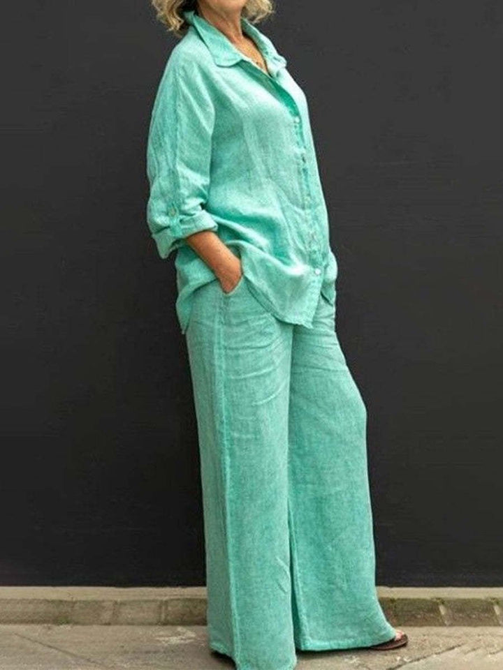 Women's two-piece cotton-linen summer outfit: stylish blouse & comfortable trousers set, ideal for warm weather.