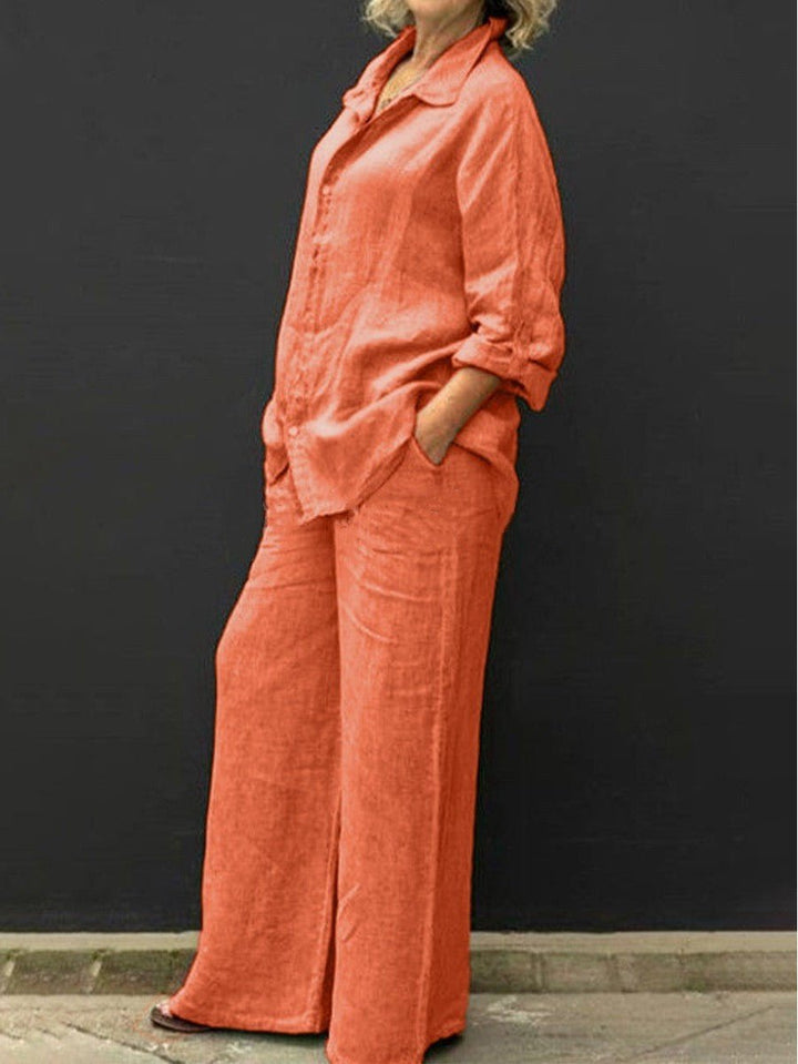 Casual yet elegant women's two-piece summer outfit, featuring a relaxed blouse & matching trousers for everyday style.