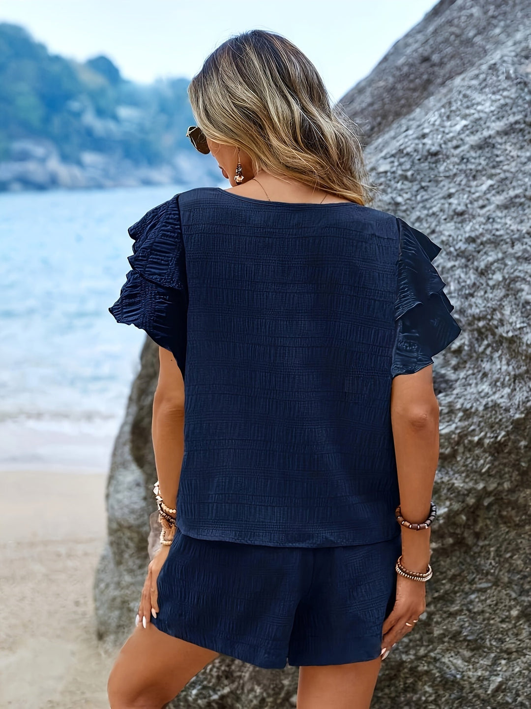 Complete women's set: elegant flared sleeve top and practical loose shorts