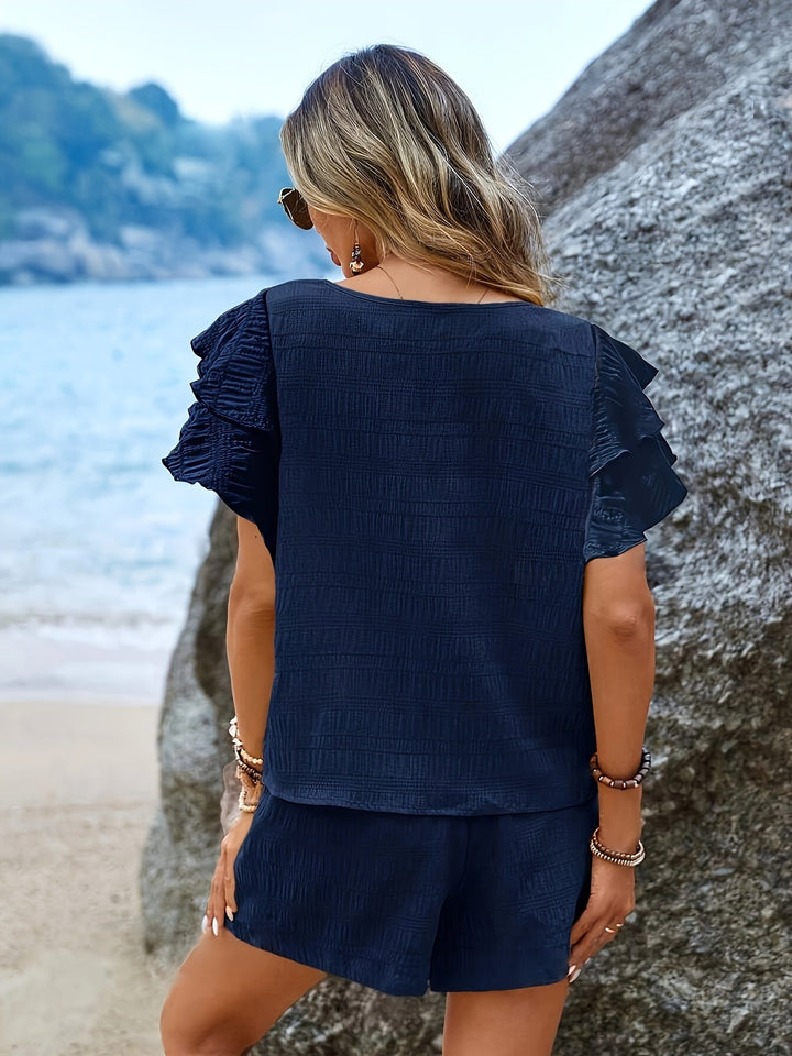 Complete women's set: elegant flared sleeve top and practical loose shorts