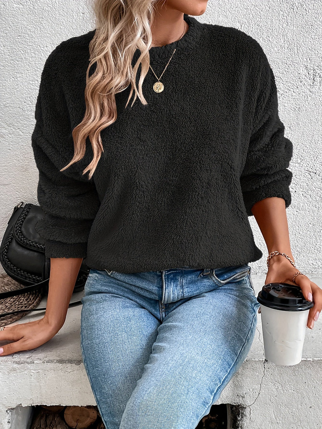 Soft Livia teddy pullover sweatshirt for women. Fuzzy, warm, & comfy long-sleeve, round-neck top for casual style.
