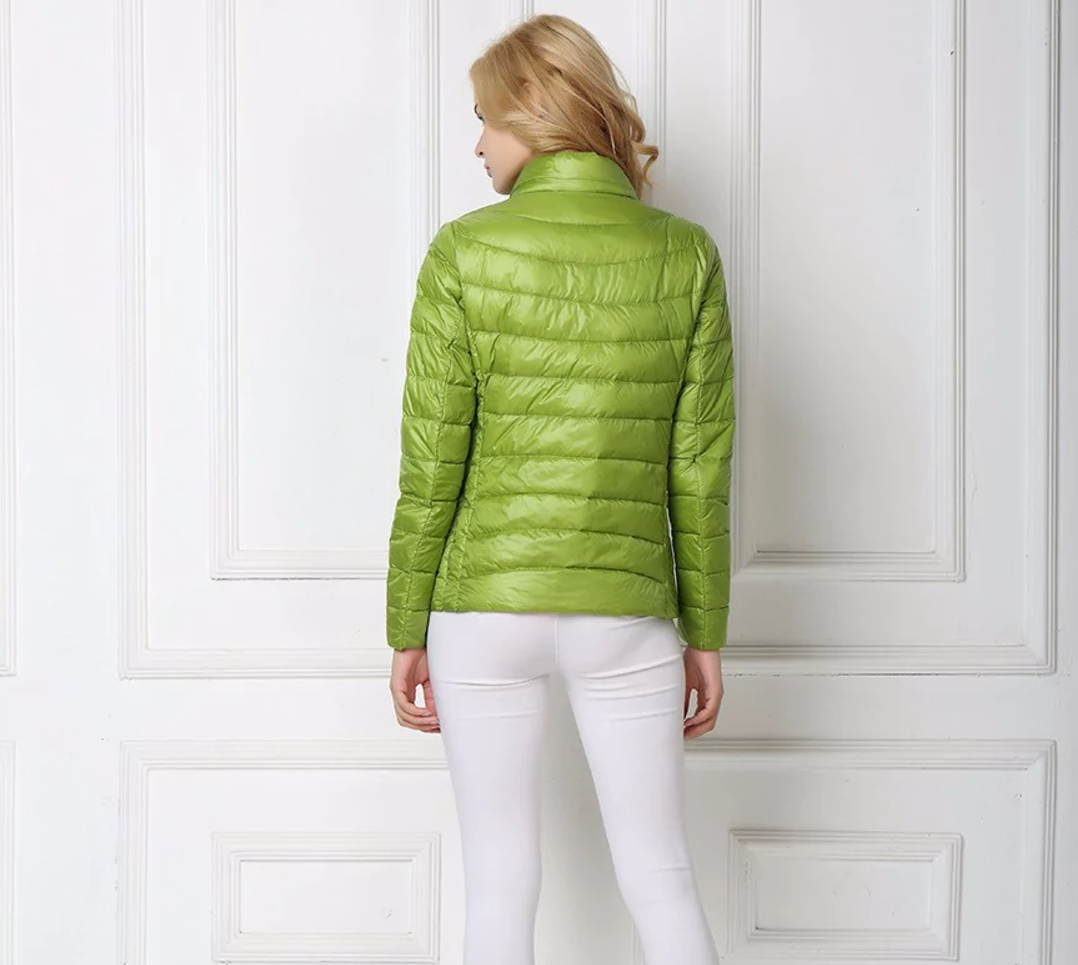 Close-up of a women's lightweight puffer jacket, highlighting its chic quilted texture and quality.