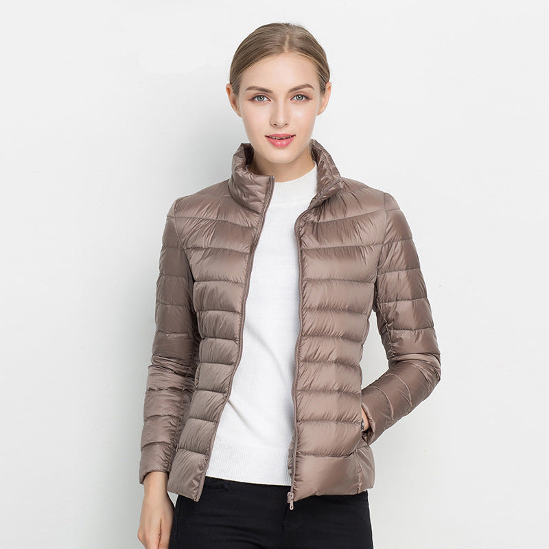 Lightweight & packable women's puffer jacket, great for travel, fall, and chic everyday style.