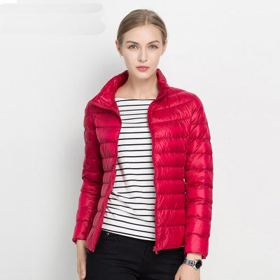 Elegant women's lightweight puffer jacket, offering chic style for urban adventures & cooler weather.