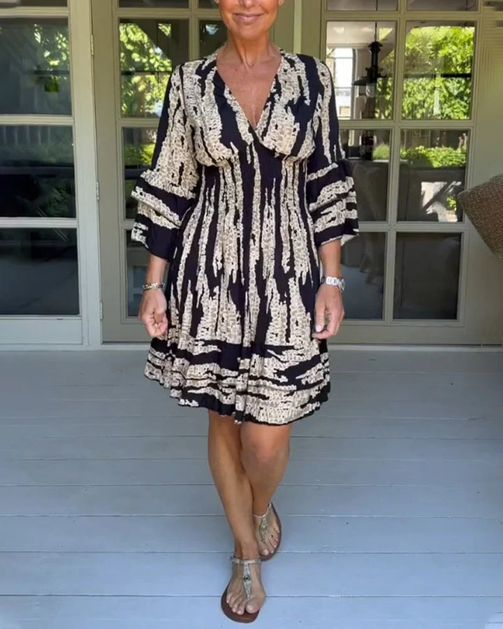 Women's V-neck A-line dress with 3/4 sleeves. Casual, flowy style perfect for spring & summer everyday wear.