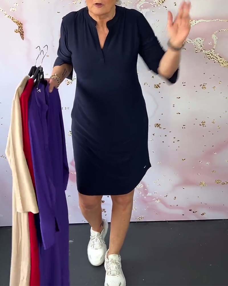 Red V-neck midi dress with convertible sleeves, offering versatile everyday style for women.