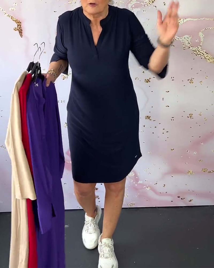 Red V-neck midi dress with convertible sleeves, offering versatile everyday style for women.