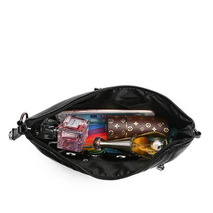 Women's practical PU leather handbag worn as a crossbody, demonstrating its versatility for active lifestyles.