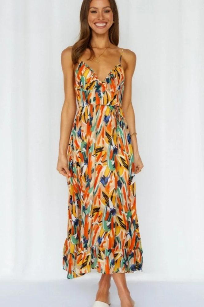 Vibrant floral print sleeveless summer dress with spaghetti straps, comfortable for warm weather.
