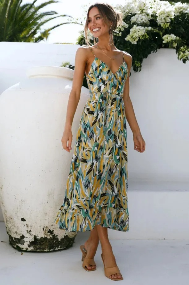 Stylish women's floral print sleeveless summer dress with spaghetti straps, flowy for vacation comfort.