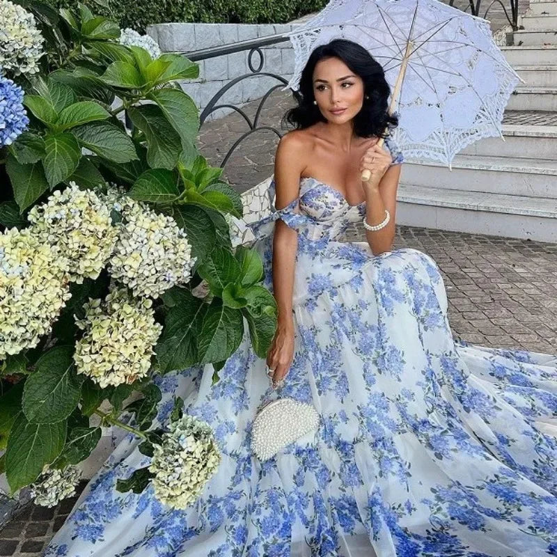 Women's vintage blue floral strapless evening gown. Elegant long formal dress for special occasions.