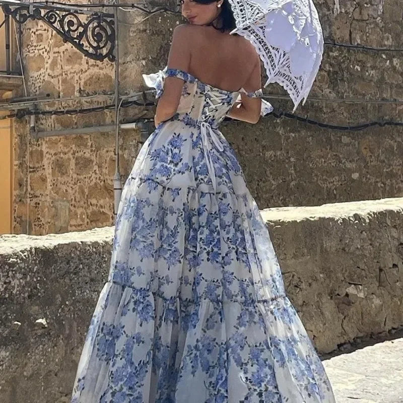 Stylish women's strapless evening gown featuring a beautiful vintage blue floral print. Perfect party dress.