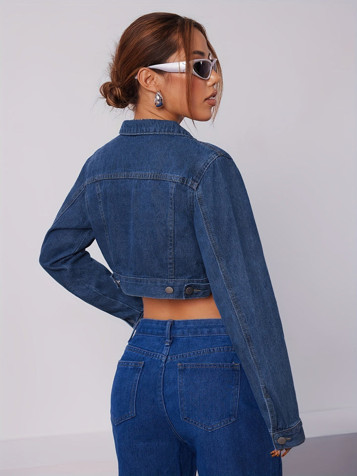 Stylish women's vintage blue fitted denim jacket, a versatile layering piece.