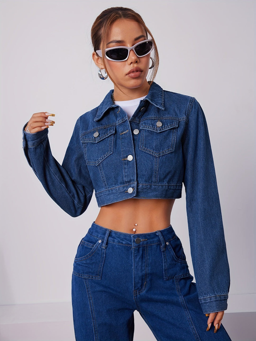 Tailored vintage blue short denim jacket for women, designed for a flattering fit.