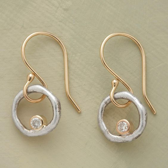 Women's vintage gold & silver zirconia earrings. Elegant jewelry with sparkling zircons, perfect for a chic look.