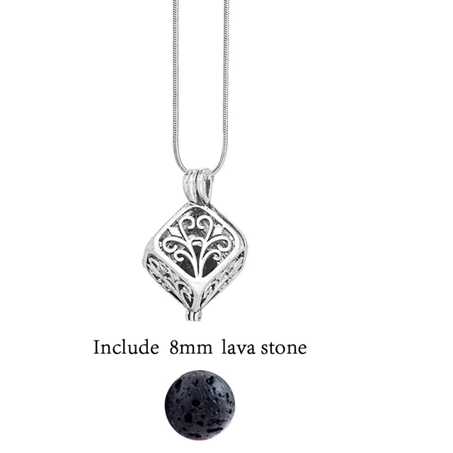 Artistic shot of a vintage lava stone essential oil diffuser necklace on a surface.