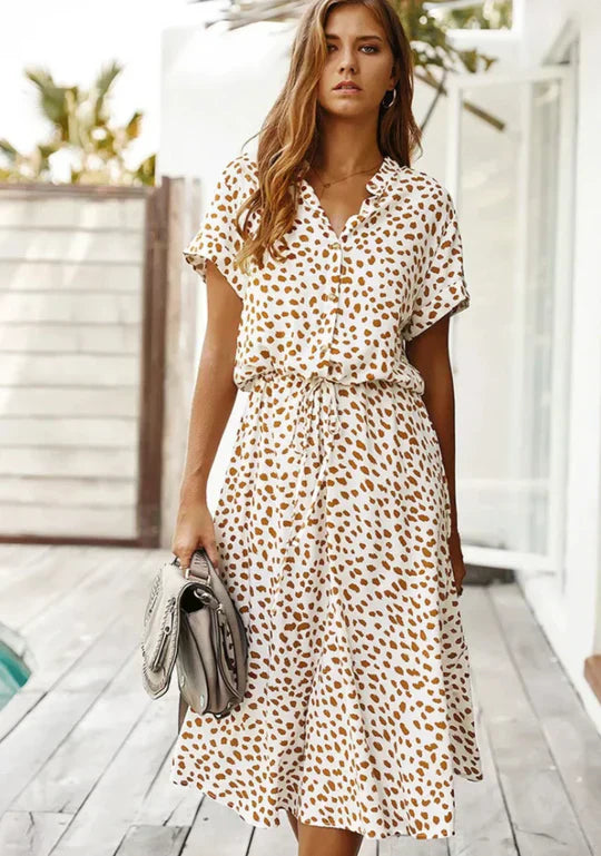 Women's vintage summer midi dress with elegant three-quarter sleeves & flowy fabric, perfect for casual outings.