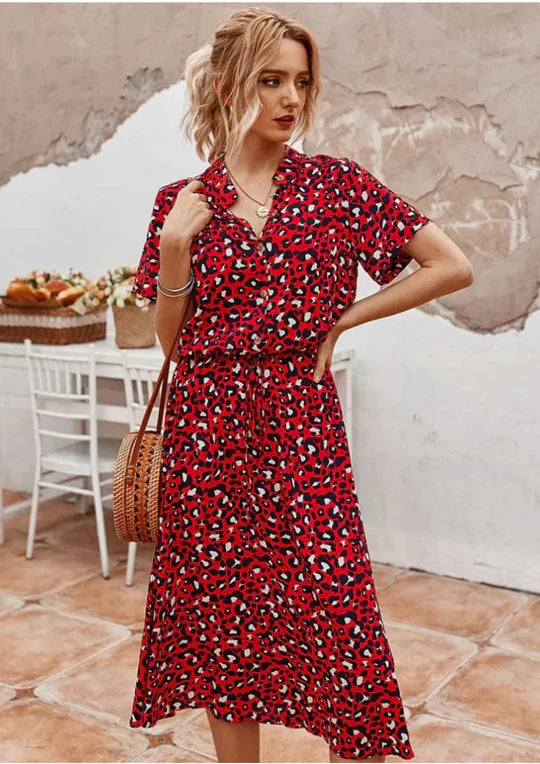 Flowy women's midi dress featuring three-quarter sleeves. A casual yet elegant vintage summer look.
