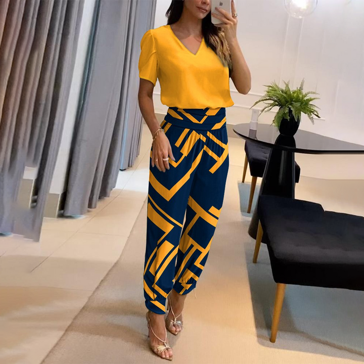 Elegant women's Viviana fashion set, a comfortable blouse & trousers ensemble for effortless and confident style.