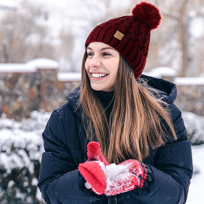 Isolate view of the Yvonne warm knit pom beanie, emphasizing its soft material and design.