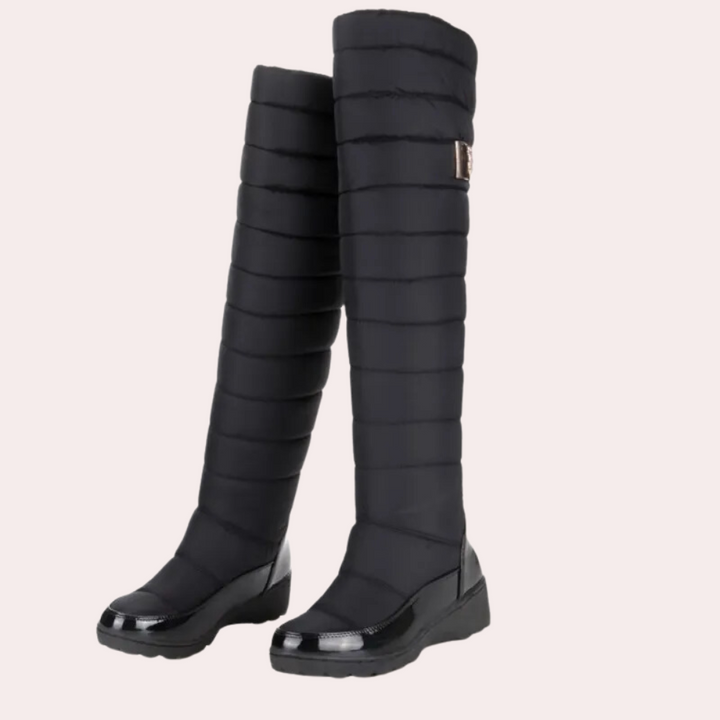 Women's warm over-the-knee boots in black, perfect for timeless winter style & comfort.