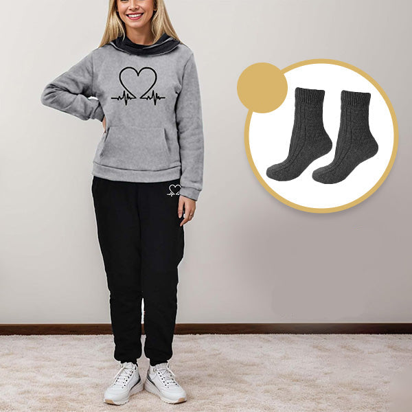 Detail of ribbed cuffs & waistband on WARMFLEX women's two-piece tracksuit, enhancing comfort & fit.