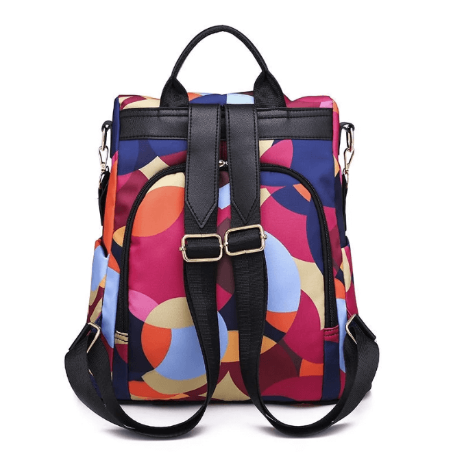 SafeHold women's anti-theft backpack in a city setting, water-resistant for urban travel