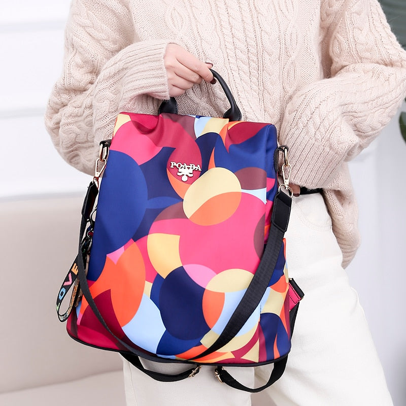 Interior view of multi-compartment women's backpack, organized storage, anti-theft design