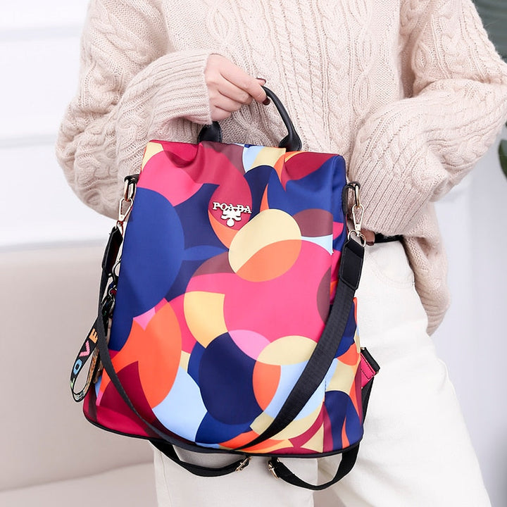 Interior view of multi-compartment women's backpack, organized storage, anti-theft design