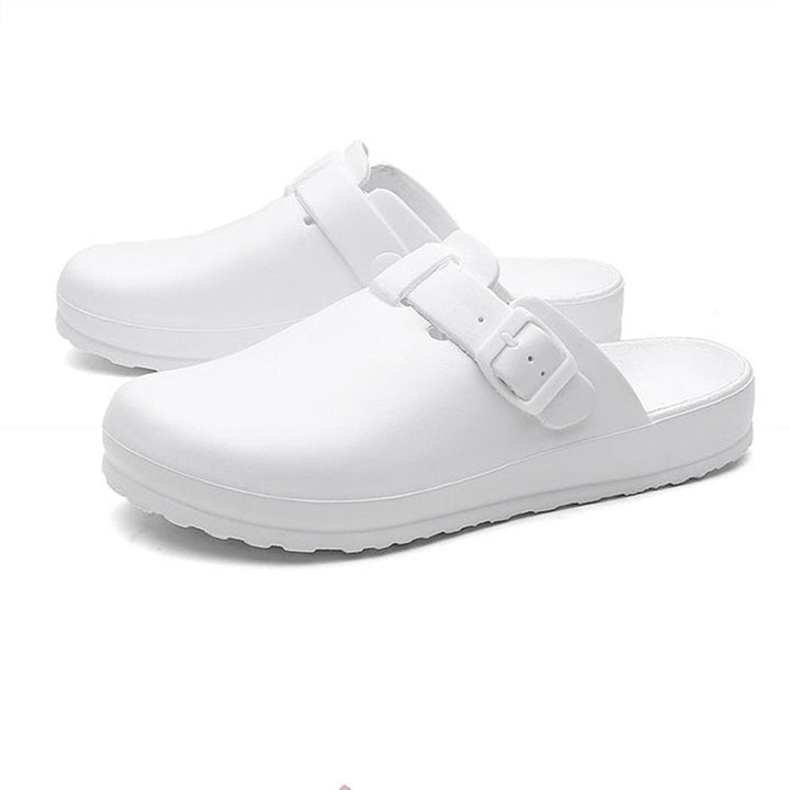 Women's waterproof healthcare clogs in use. Slip-resistant and lightweight for active work environments.