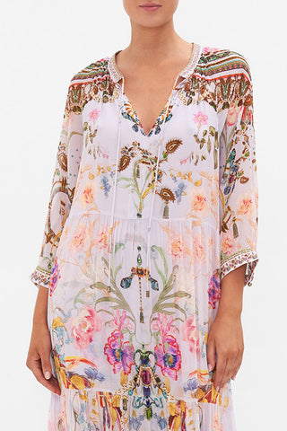 White flowy Bohemian maxi dress for women, featuring a beautiful floral print. A chic choice for summer & vacation.
