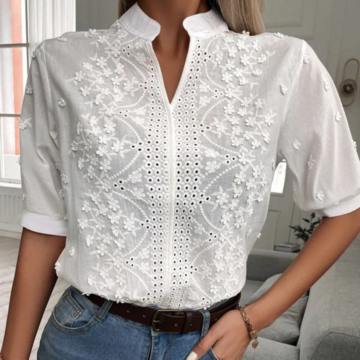 Women's white relaxed blouse, Serena style, offering effortless chic comfort for versatile spring & summer fashion.