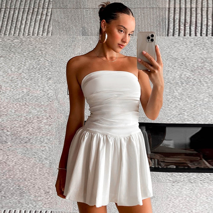 Stylish white strapless pleated mini dress for women, a perfect summer outfit for any festive occasion.