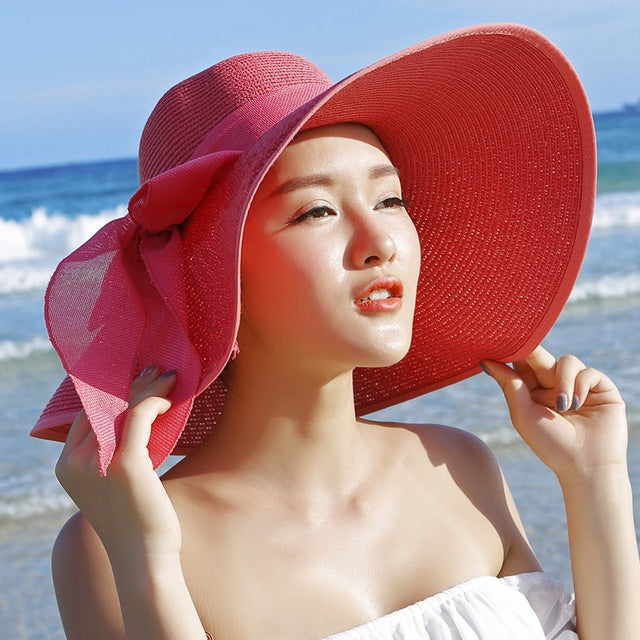 Women's wide brim straw hat, offering ultimate sun protection, a versatile summer and travel accessory
