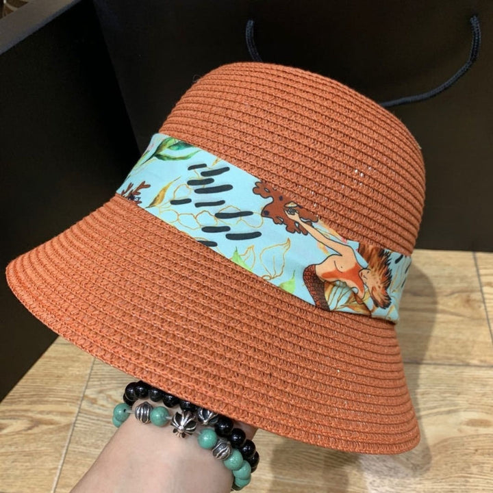 Classic summer hat for women featuring a chic bow and extra-wide brim.