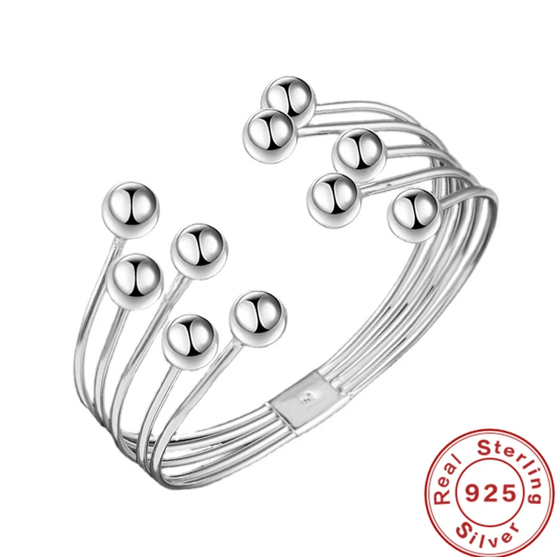 Women's wide pearl bracelet crafted from 925 sterling silver. Elegant freshwater pearl classic jewelry.