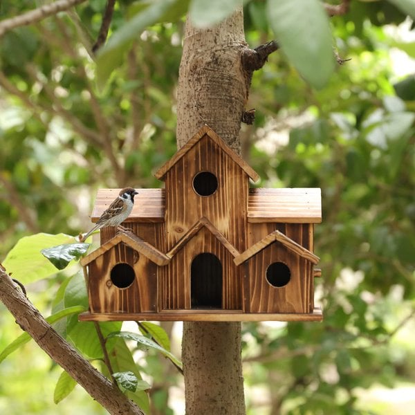 Wooden birdhouse, Nestora, designed as a safe and warm nesting box for small birds