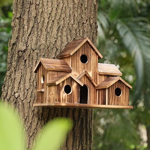 Nature-inspired Nestora wooden birdhouse for garden birds, a functional nesting box